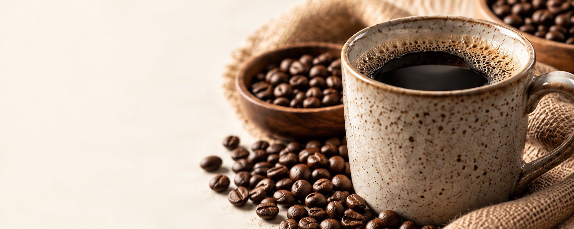 Morning coffee in a ceramic mug with roasted coffee beans